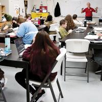 Guy Holland taught his seventh-graders about hurricanes during a science class