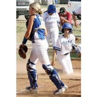 Union City’s Lily Russell looks for teammates reactions after dodging a tag at the plate for her inside the park home run.