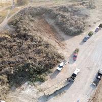 Photo shows a line of vehicles waiting to unload