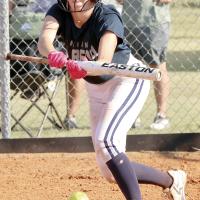 Maddy Brinkman squints as she drops down a bunt