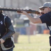 Smoke can be seen coming out of the barrel of Madison Patswald’s gun