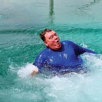 Matt White hits the water after trying out the new slide at the pool