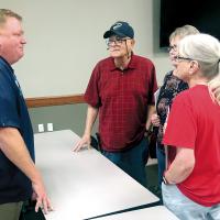 Matt White visits with Fred Albers, Jane Albers and Kathy Funk
