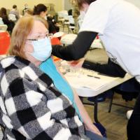 Maureen Mula of El Reno gets her shot from Debbie Maguire