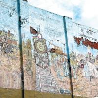 The Heritage Mural was created in 1980 by the late Charlie Beecham
