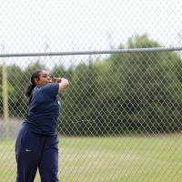 Mya Robles lets loose of a throw in discus