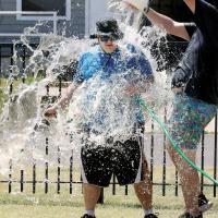 Nathan Leonard takes a bucket of cold water over the head