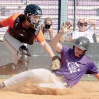 Kaleb Thiessen attempts to tag out a Bethany base runner