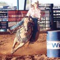 Jaden Smith leans hard into the third turn in the barrel race