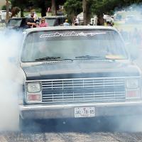 Kevin Watson (orange cap) watches this pickup churn out the smoke