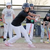 Maddox Tartsah drops down a bunt during a drill