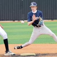 Maddox Ferguson blocks a wide pickoff throw to second base