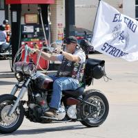 Matthew Wickware rides his motorcycle down Sunset toward the starting point