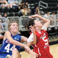 Tetona Blackowl has her arm hooked on a rebound attempt
