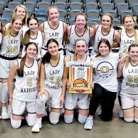Okarche High School’s girls basketball team and coaches pose with the trophy