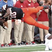 Rashod Owens leaps horizontally as he tries to pull in a pass