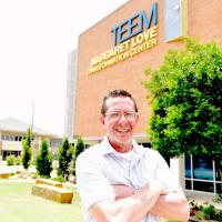 Kris Steele poses in front of the TEEM building in Oklahoma City
