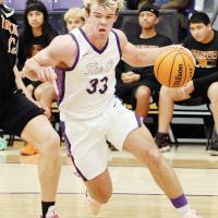 Easton Roby drives the baseline around a Tonkawa defender