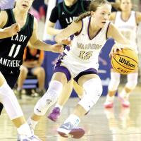 Katie Parham (13) dribbles the ball through Amber-Pocasset defenders