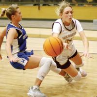 Jadyn Rother dives for a loose ball