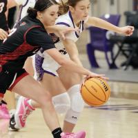 Reese Robinson (20) tries to steal the ball away from a Geary player