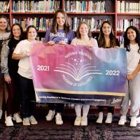 Accepting the banner and plaque won by the 2022 yearbook staff