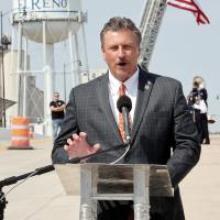 Tim Gatz speaks to the crowd at the opening of the Rock Island railroad overpass