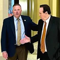 Lonnie Paxton and Jimmy Harrel shake hands