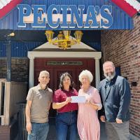 Left to right, Javier and Rosalina Pecina along with Carolyn Husmann and Matt Whetzel