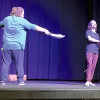 Actors run through a scene
