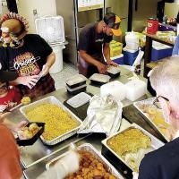 Volunteers package lunches
