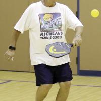 Pete Stapperfend steps into a backhand return shot
