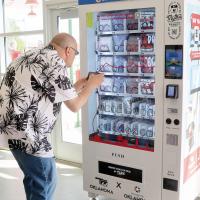 Mike Faust takes a picture of a new Route 66 merchandise vending machine