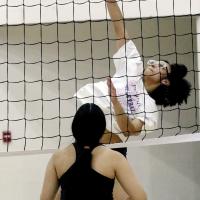 Qyra Jones attempts a kill during a pool play match