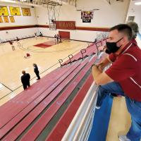 Eli Zucksworth looks out over an empty RCC gymnasium