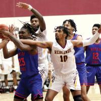 RCC men’s basketball_Lyons battles for rebound