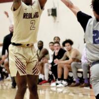 Elijah Herron shoots a 3-pointer