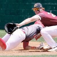 Ryan Sessions eyes a pickoff throw to first base