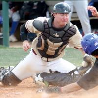 Austin Hamilton squints as he makes a sweep tag