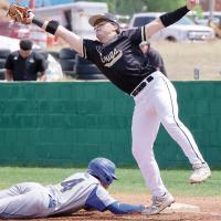 Jackson Blackmon has a wide pickoff throw hit off his outstretched glove 