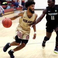 RCC mens basketball_Coppage dribbles past