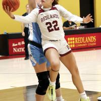 Alaysia Burrough attempts an underhanded scoop shot