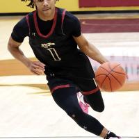 Camren Hunt dribbles into the lane