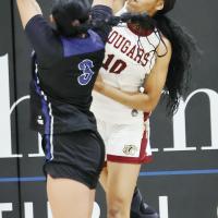 Myracle Washington (10) reaches up to block a shot