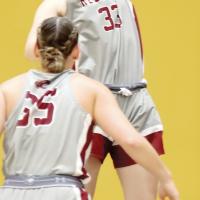 Anni Heikkila leaps into the air to grab a rebound