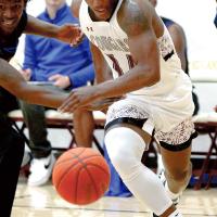 Kalep Crane pushes off a defender to chase down a loose ball