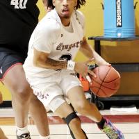 Treston Gage dribbles the baseline
