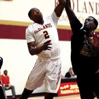 RCC mens basketball_Herron takes ball to hoop