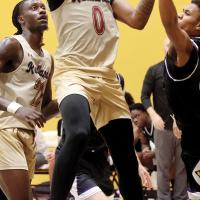 Savon Myers reaches around a Thunderducks defender to get off a shot