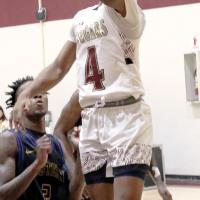 Khyree Taylor jumps past an Eastern defender for a layup attempt